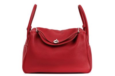 a red handbag on a white background