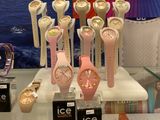 a lot of watches on display in a glass case