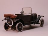 a toy car that is sitting on a white surface