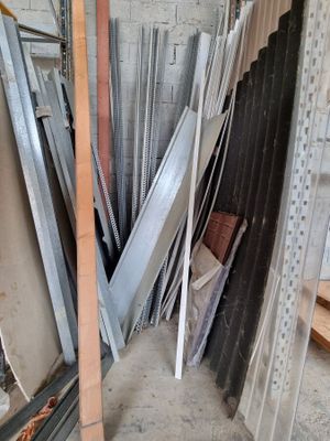 several pieces of metal are stacked up in a pile in a room
