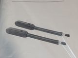 two pens are sitting in a plastic bag on a table