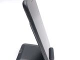 a cell phone that is sitting on top of a stand