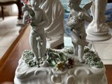 a table with statues and figurines on top of it