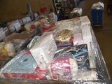a table with many items wrapped in plastic on it