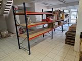 a room that has a lot of shelves and boxes on it