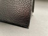 a black wallet that is sitting on a table