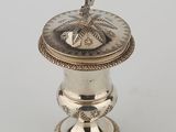 a silverplated incense box with a lid and stand