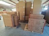 many boxes stacked on pallets in a warehouse