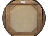 an old wooden frame with a piece of paper in the middle