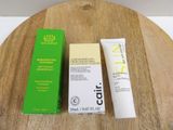 a bottle of lotion and a tube of lotion sitting on a table