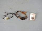 two bracelets and a book laying on a table