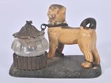 a statue of a dog with a bowl on a table