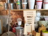many cups and cups on the shelves in the kitchen