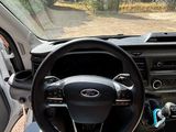 a car dashboard with a steering wheel and a dash board