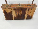 a small wooden box with a handle on a table