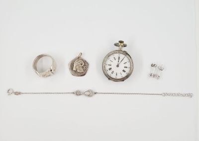an assortment of jewellery including a watch, bracelet, and ring