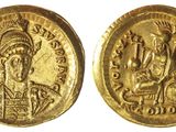 une pièce d'or portant l'image d'un homme et d'une femme