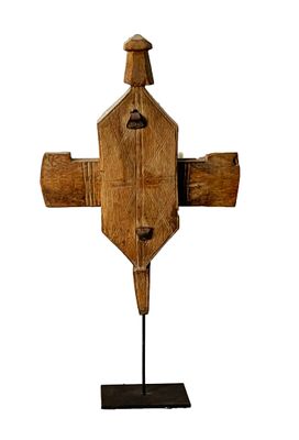 an old wooden cross on a stand on a white background