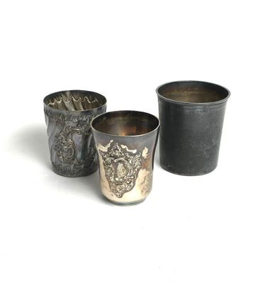 three cups sitting next to each other on a white surface