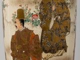 a vase with a picture of a man and a woman on it