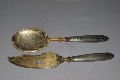 two spoons that are sitting on a table