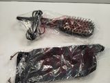 two hairbrushes wrapped in plastic on a table