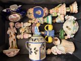 a black box with a bunch of ceramic figurines in it