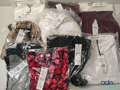 a lot of clothes that are wrapped in plastic bags