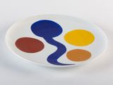 a white plate with a blue, yellow, and red design on it