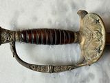 a close up of a sword that is on a table