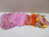 a pile of cloth on a table next to a wall