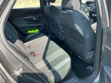 the back seat of a car with a green sticker on it