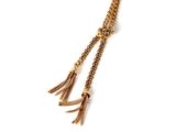 gold tone chain tassel with gold tone beads on a white background