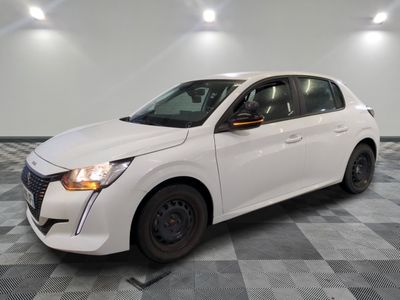 the white car is parked in the garage on a checkered floor