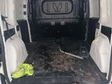 the back of a van with the door open and the back of the van with the back door open