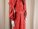 an image of a mannequin dressed in a red dress and hat