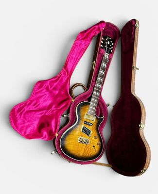 an image of a guitar and a case on a white surface