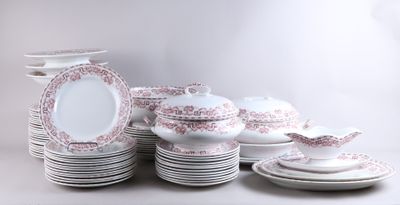 a lot of plates and bowls on the table