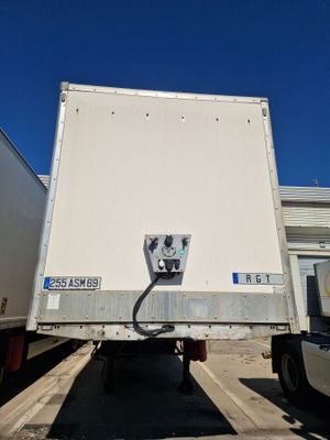 a white truck that is parked in a parking lot