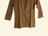 a brown shirt hanging on a hanger on a white wall