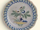 a plate with a picture of a bird on it