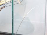 a glass case with a model of a boat in it