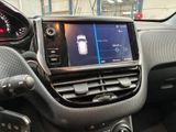 the dashboard of a car with a digital display in the center of it