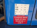 a close up of a blue vehicle with a sticker on it ' s side