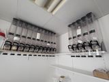 a room with a lot of empty containers on the shelves