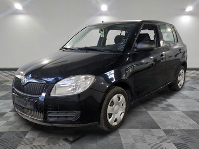 a picture of a black car parked in a garage