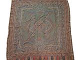 un gros plan d'un tapis orné d'un motif