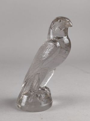 figurine en verre argenté représentant un oiseau perché sur un socle