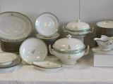 a lot of plates and bowls on a table