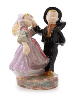 a figurine of a man and a woman standing next to each other